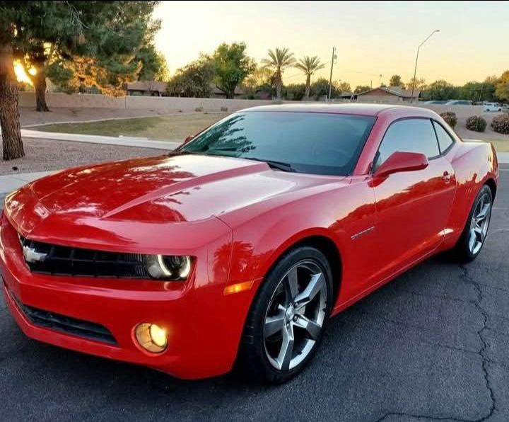 Red Chevrolet Camaro parked outdoors